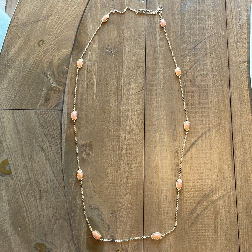 Kendra Scott necklace with peach stone pendants, gold necklace